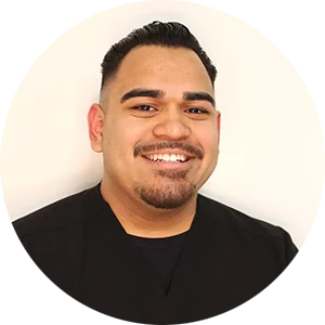 Professional portrait of Eric Corrales, the dedicated Office Manager ensuring a smooth and welcoming patient experience at Harmony Dental Care